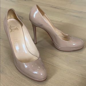 Nude patent Christian Louboutin heels.